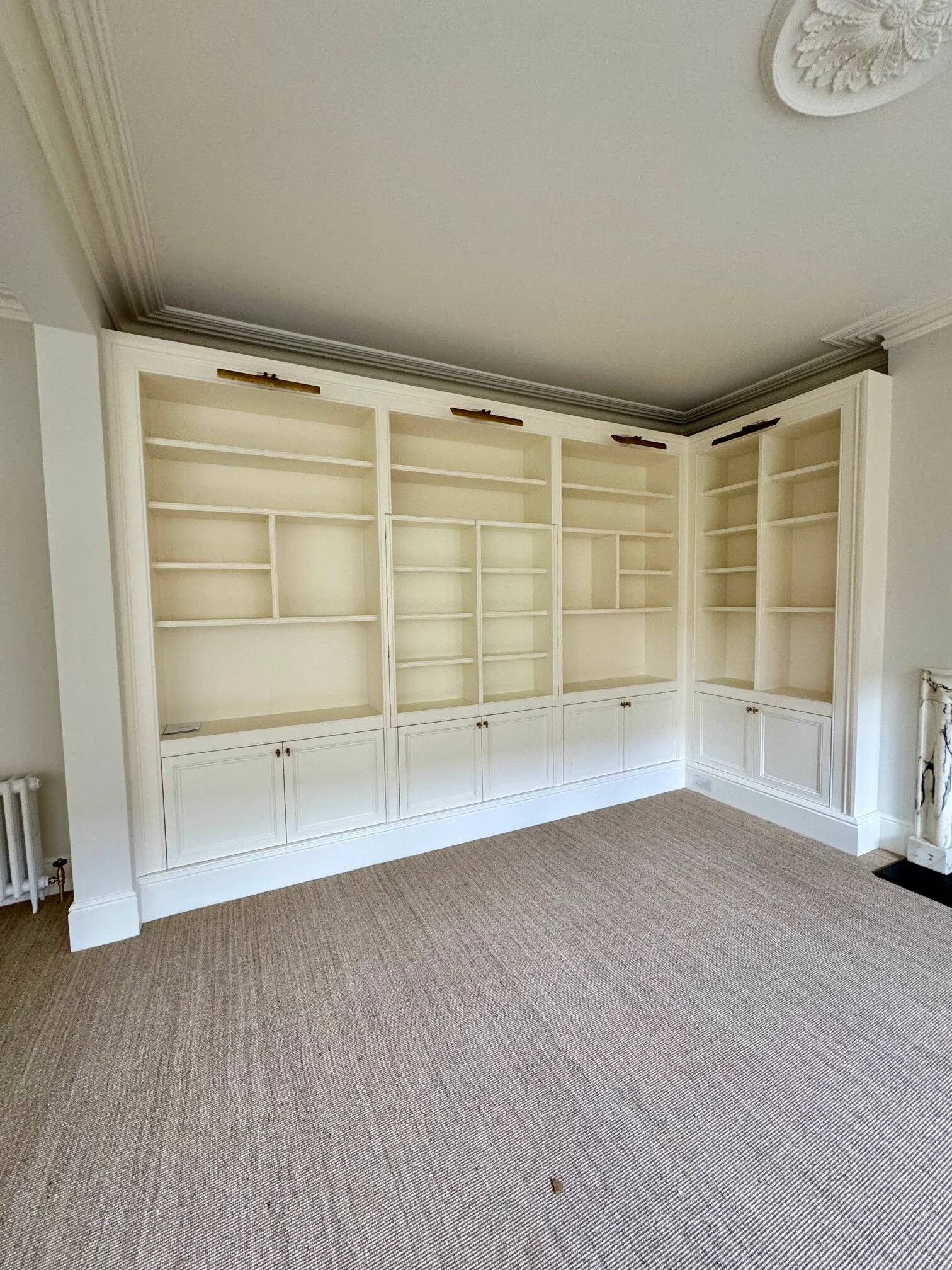 white alcove units in the living room