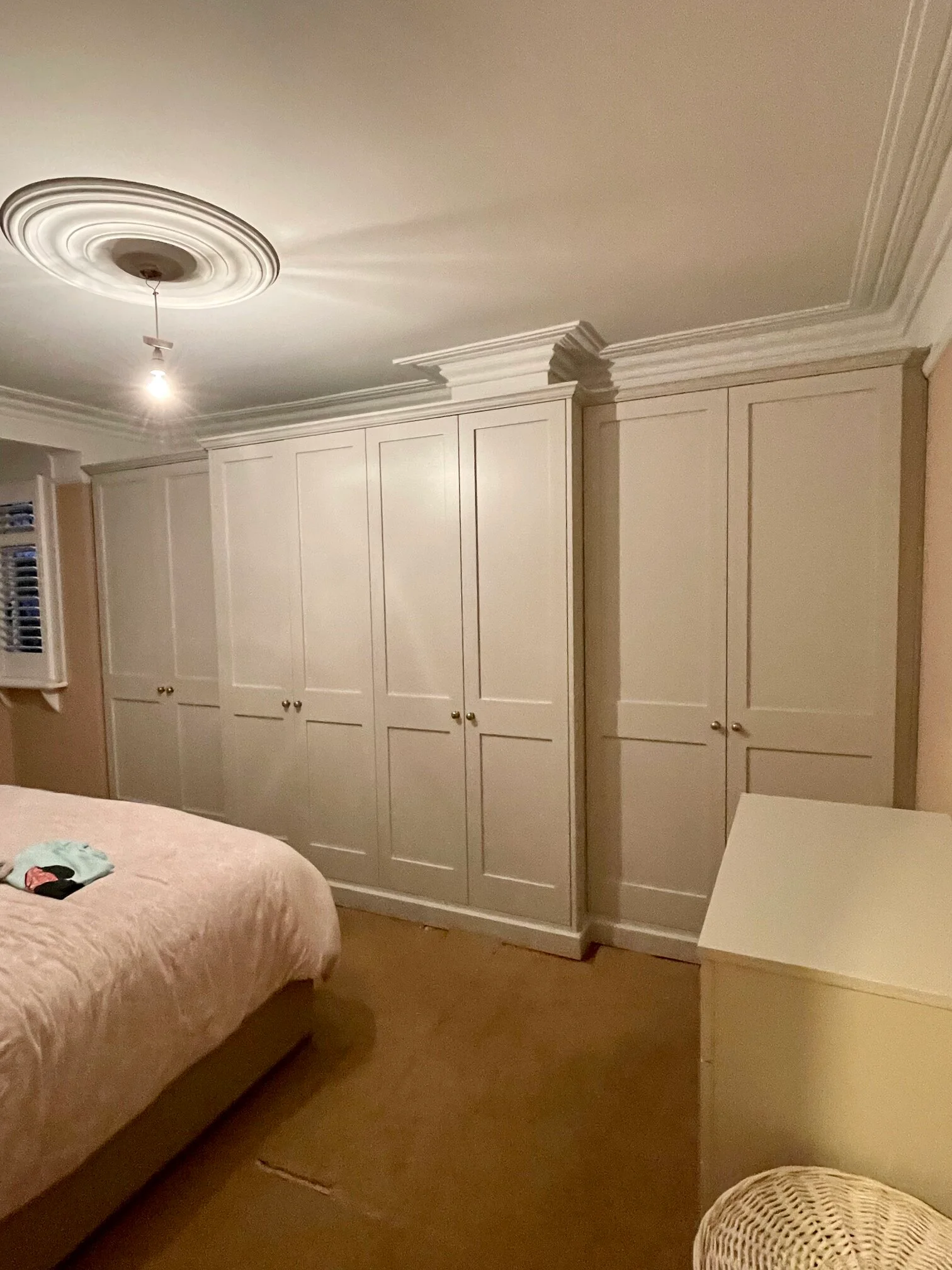 white bespoke fitted wardrobes near me in a bedroom