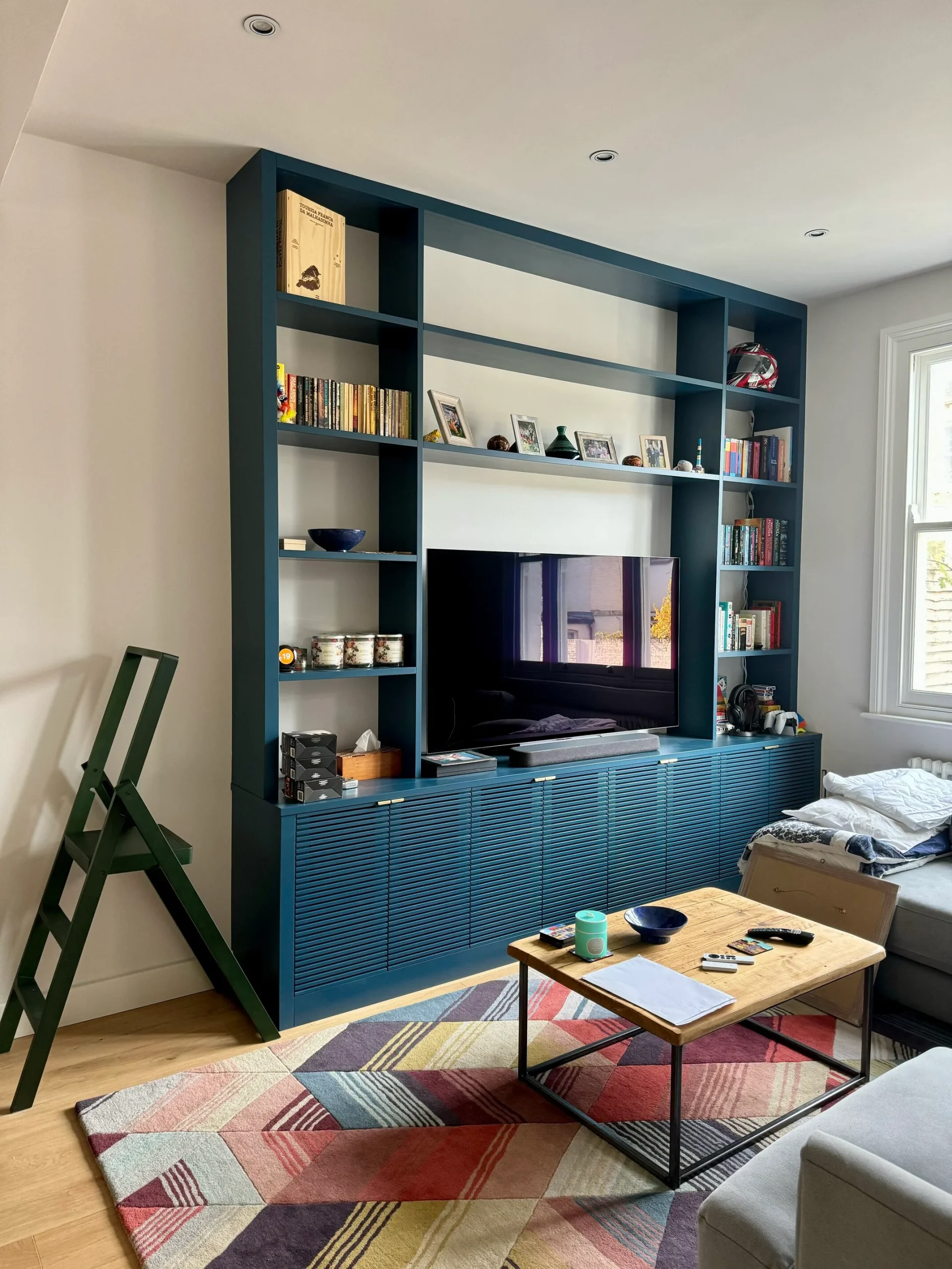 blue custom tv units in the living room
