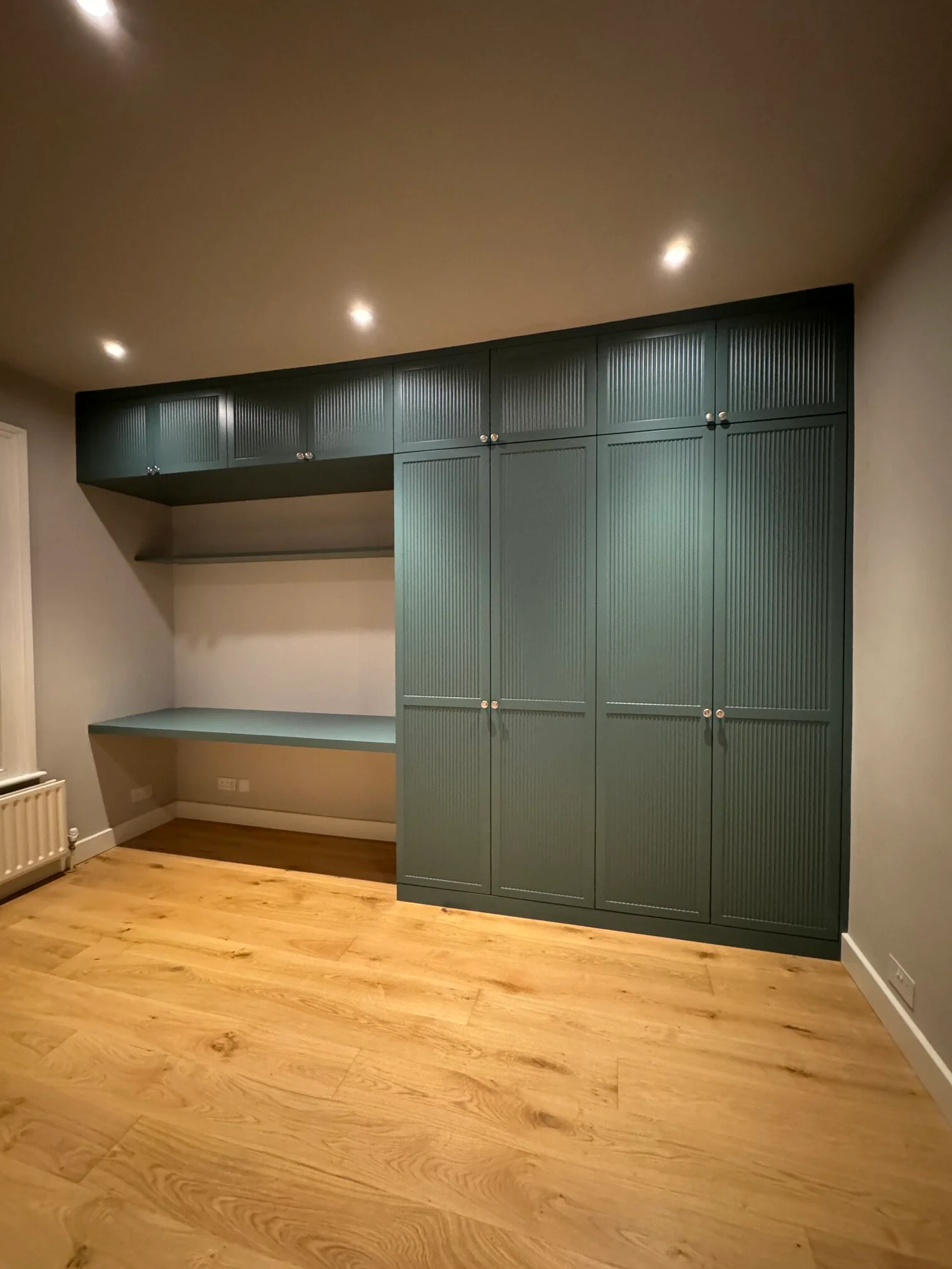 green bespoke fitted wardrobes near me with closed doors