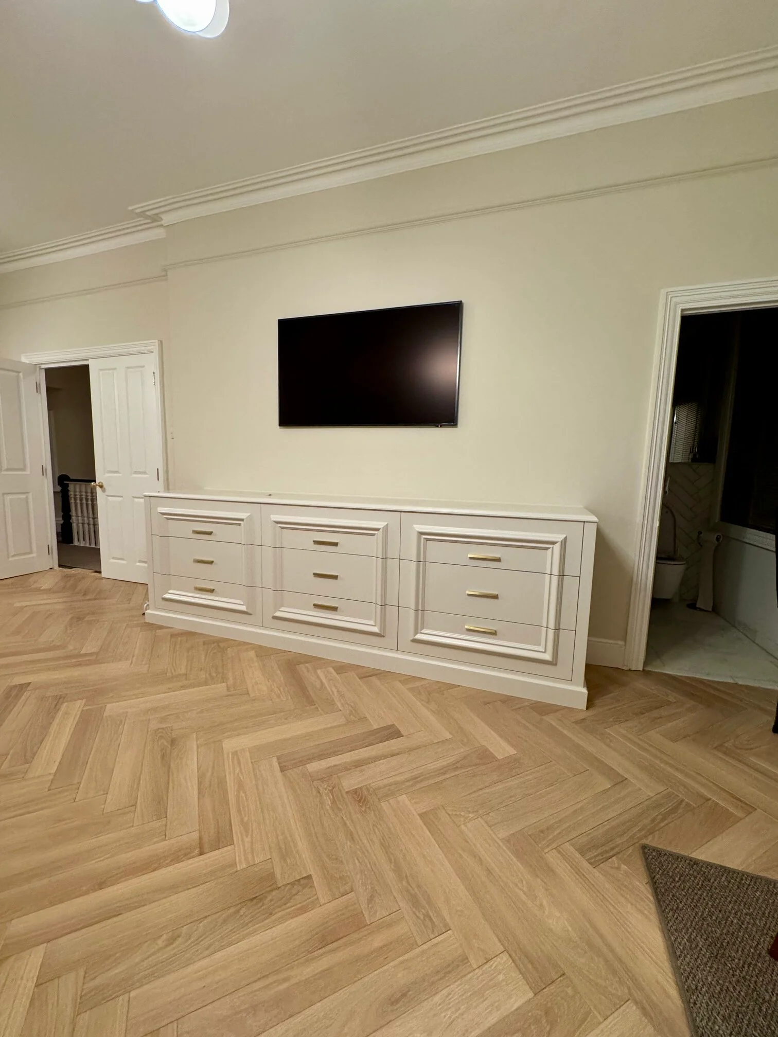 white custom tv units in the living room