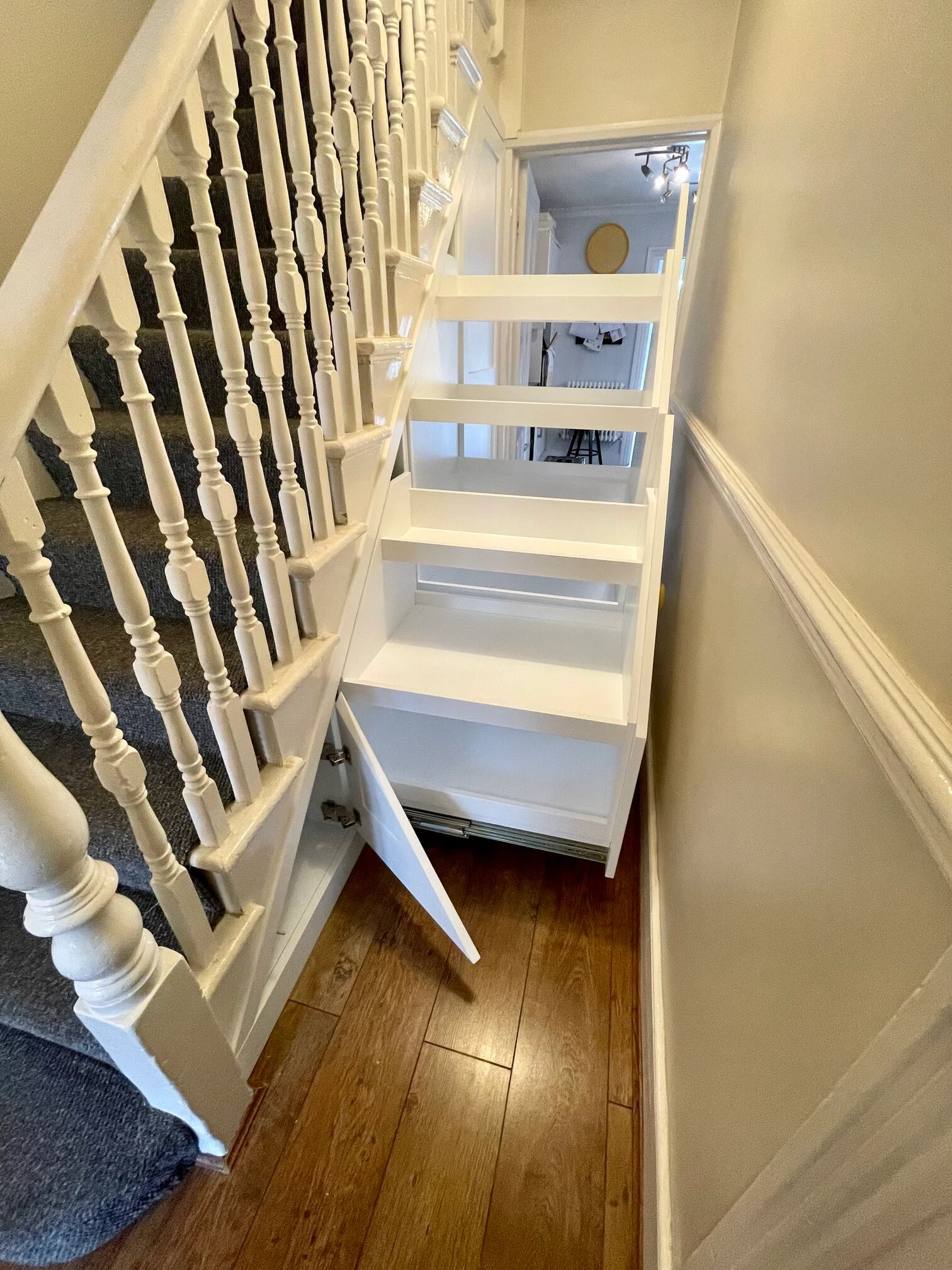 custom cabinets under the stairs made by bespoke furniture maker near me